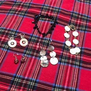 A bundle of jewelry.  Two bracelets and three pairs of earrings.